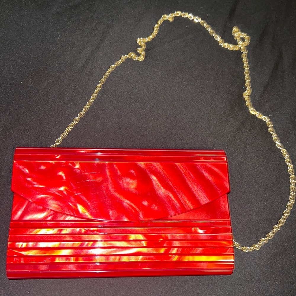 Red purse with gold chain